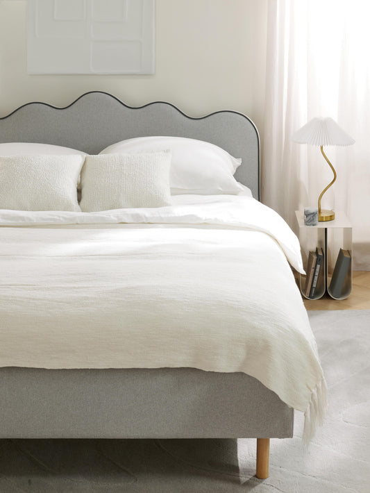 Romelle Upholstered Bed with Wavy Headboard