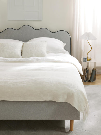 Romelle Upholstered Bed with Wavy Headboard