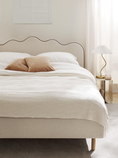 Romelle Upholstered Bed with Wavy Headboard